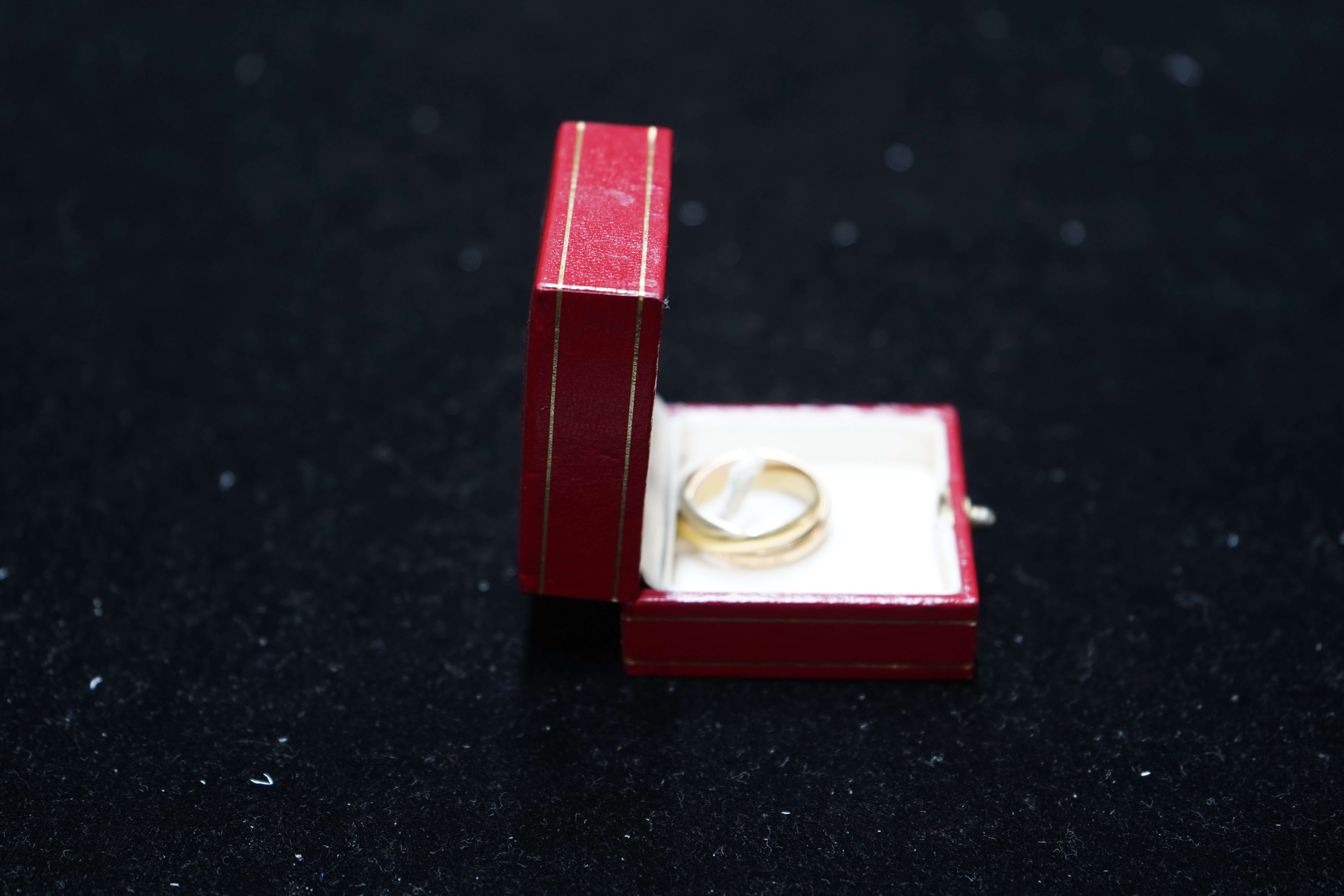 A modern Must De Cartier three colour 18k gold triple band 'Russian' wedding ring